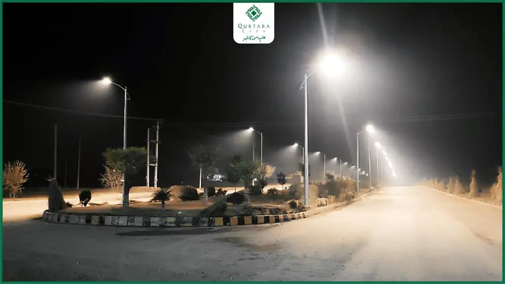 At night, Qurtaba City transforms into a mesmerizing sight with its glowing lights. From the main gate to the central boulevard and extending to Blocks C and D, the network of streetlights not only enhances the city’s beauty but also ensures a safe, illuminated, and comfortable environment.