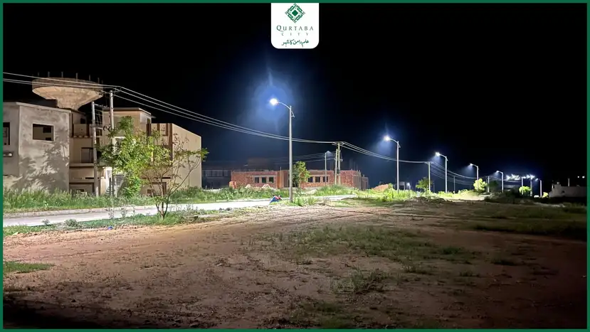 Beyond their aesthetic appeal, these lights serve a practical purpose, ensuring convenience and safety for residents. They make nighttime movement secure and fill the city with a lively glow that fosters a sense of vitality. The illumination in Qurtaba City goes beyond physical lights; it reflects our commitment to providing an exceptional community experience. With state-of-the-art infrastructure, over 60 completed homes, an Olive Garden, and symbolic landmarks like the Palestine and Book Monuments, Qurtaba City is shaping a model society.